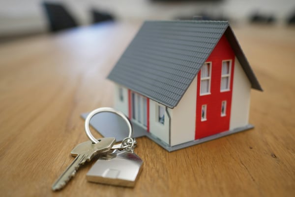 House model with keys on a desk
